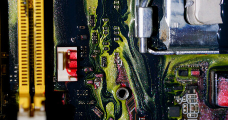 Wall Mural - Acrylic ink. Circuit board. Blur yellow purple red colorful glitter liquid microchip dark black water on abstract electronic background.