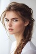 © Татьяна Евдокимова - Young woman posing looking at camera, featuring a casual side braid with natural makeup and a relaxed, fresh beauty look
