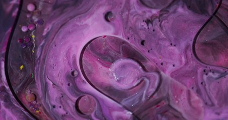 Wall Mural - Bubbles stream. Oil drop. Defocused purple red yellow color glitter fluid round ink water emulsion floating on abstract art background.