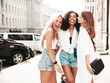 © halayalex - Three young beautiful smiling hipster female in trendy summer clothes.Sexy carefree multiracial women posing on the street background.Positive models having fun