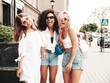 © halayalex - Three young beautiful smiling female in trendy summer clothes.Sexy carefree multiracial women posing on the street background.Positive models having fun in sunglasses. Cheerful and happy