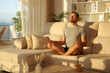 © Antonioguillem - Man at home meditating doing yoga exercises at sunset