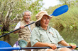 © CandyRetriever  - Happy Asian senior couple kayaking in the river on summer holiday vacation. Healthy retired elderly people enjoy and fun outdoor active lifestyle travel nature, sport and rowing a boat in the lake.