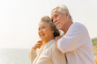© CandyRetriever  - Happy Asian family senior couple enjoy outdoor lifestyle travel nature ocean relaxing together at tropical island beach on summer holiday vacation. Elderly people healthcare and wellness concept.