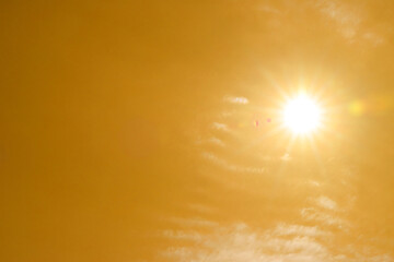 Wall Mural - bright sun in orange sky during hot summer weather. extremely high temperature