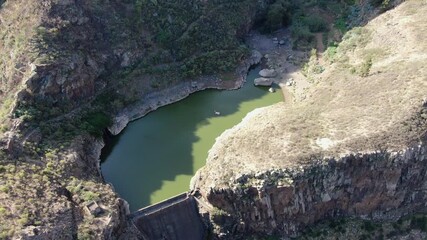 Wall Mural - Scenic drone footage flying over the Tierras de Manuel Dam and reservoir in the Agaete Valley. Gran Canaria