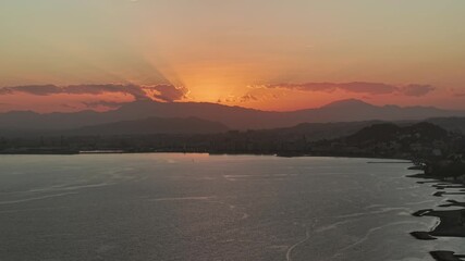 Wall Mural - Sunset over calm sea with mountains in Malaga, Spain. Tranquil mood