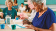 © Monkey Business - Group Of Retired Seniors Attending Art Class In Community Centre With Teacher