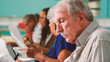 © Monkey Business - Group Of Retired Seniors Attending IT Class In Community Centre