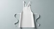 © MBAK NAH - Pristine White Culinary Apron Mockup with Soft Shadows, Laid Flat on a Neutral Gray Background.