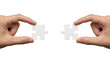 © FahrulRosi - Puzzle pieces held by hands connection