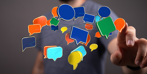 Man touching digital speech bubble icons demonstrating communication concept. Connection with message symbols for web design and social media us