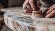 © Ilmi - Application of Wax Finish on Polished Marble Countertop with Hands Using Tool in Artisan Workshop