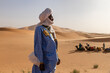 © ADDICTIVE STOCK - Camel trek through the Sahara desert dunes in Morocco
