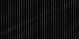 Black corrugated metal texture background for abstract dark design and industrial wall paneling pattern