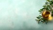 © JoxyAimages - A glass filled with golden liquid rests atop a textured turquoise surface, accompanied by fresh olive leaves, creating a refreshing and inviting atmosphere.