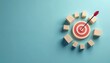 © Vadym - Red arrow hits aim on wooden target. Blocks symbolize success, strategy on blue backdrop. Visual represents achieving business goals, planning. Concept for marketing promotion. Idea for innovation,