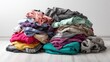 © Pixelzone - Stunning photo of pile of colorful laundry waiting to be folded or put away.