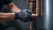© Pixelzone - Stunning photo of plumber wearing gloves connects copper pipes with brass fittings.