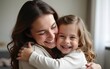 © li - Close up side view overjoyed smiling young mother and daughter hugging and laughing, enjoying tender moment, happy mum and adorable preschool girl kid cuddling, having fun together at home