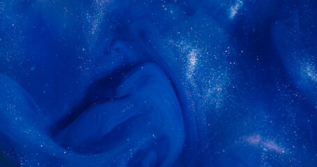 Wall Mural - Shiny ink. Blue glitter splash. Defocused cosmic color bright texture creative acrylic cloud spreading on abstract bokeh background.