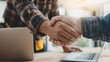 © Mongkol - Business meeting handshake between man and client during interview for contract signing in modern office environment from close viewpoint