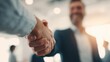 © Mongkol - Business interview handshake between client and man finalizing contract in modern office environment with professional viewpoint