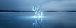 © Анна Мартьянова - Transparent ice percent symbol on frozen lake. Concept of cold economy, interest rates, winter finance, frozen assets, risk. banner
