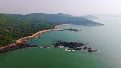 Wall Mural - Aerial view backwards in front of the Om beach, hazy sunrise in Gokarna, India