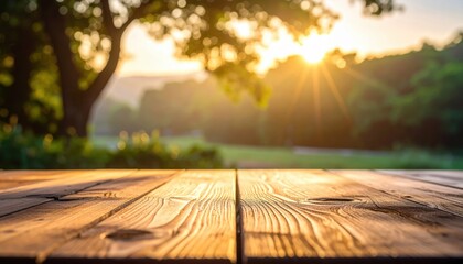 Wall Mural - Serene sunset view over a wooden table in a lush green park, capturing nature's tranquility