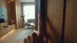 © Su - Person touching door in modern interior selective focus on finger warm tones