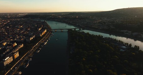 Wall Mural - Scenic overlook of Budapest at dusk with the Danube River and iconic bridges, capturing the warm evening light over Hungary’s historic capital city.