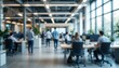 © Zahid - A blurred image of a modern office space with people working at work