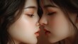 © Nongkran - Close Up Portrait of Two Young Women Displaying Intimacy and Connection in Soft Lighting
