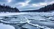 © MDSABBIR - Frozen river with circular ice floes and snowy forest