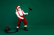 © deagreez - Festive Santa Claus rocking out with a vacuum cleaner on a green background embodying humor and Christmas spirit