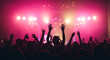 © SAYED - Excited crowd hands up at vibrant concert under pink stage lights celebration