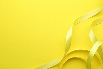 Wall Mural - Beautiful ribbons on yellow background, flat lay. Space for text