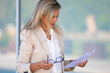 © carballo - attractive mature businesswoman with document