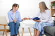 © New Africa - Professional psychotherapist working with patient in office