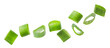 © New Africa - Fresh cut green onion flying on white background