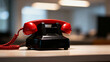 © huanghe - Vintage red telephone receiver on a black base, showcasing retro communication design. mobility guides, transit brochures, designed for mobility and urban transit guides.