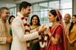 © Who is Danny - Traditional Indian wedding ceremony with bride and groom exchanging garlands in front of smiling family members in bright indoor setting. Ai generative