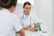 © BusinessClass by W61 - Doctor consulting with patient in medical office during appointment