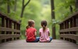 © yuan - Siblings sitting on a wooden bridge in a forest, portrait. High quality