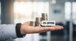 © K_IMAGE - Hand Holding Stacked Coins With 0 Percent Offers Tag Soft Focus Office Background