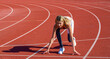 © Yevhen - Female athlete ready to run on running track. Girl getting ready at starting position line for sprint. Running and woman at start line training for marathon race event at stadium