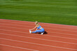© Yevhen - Female runner stretching before workout. Sports exercises and stretching in the stadium. Physical training girl. Fit girl do outward lunging
