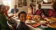 © Yuliya - A black boy smile  while sitting at a festive table. Traditional festive Thanksgiving turkey dinner. Black family Cheers Celebrating Thanksgiving Holiday Concept.