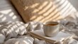 © AUAChanel - Warm Cup of Coffee on a Notebook Surrounded by Cozy Bedding and Beautiful Sunlight